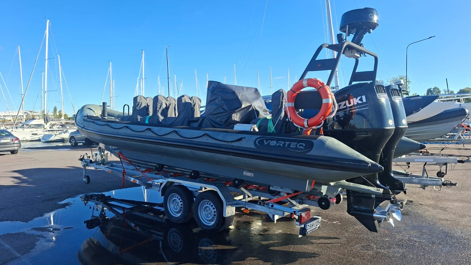 Vorteq RIB with twin Suzuki outboards on its trailer